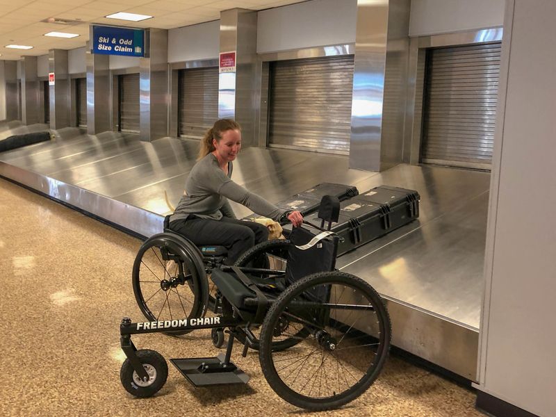 Flying With the GRIT Freedom Chair: arriving at destination airport claiming off-road wheelchair at Odd Size Claim baggage area